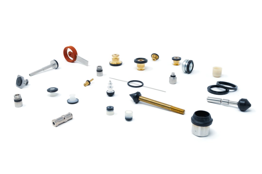 Co-molded, metal or plastic-to-rubber parts
